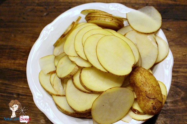 thinly sliced potatoes for homemade potato chips thinly sliced potatoes for homemade potato chips by AttaGirlSays.com