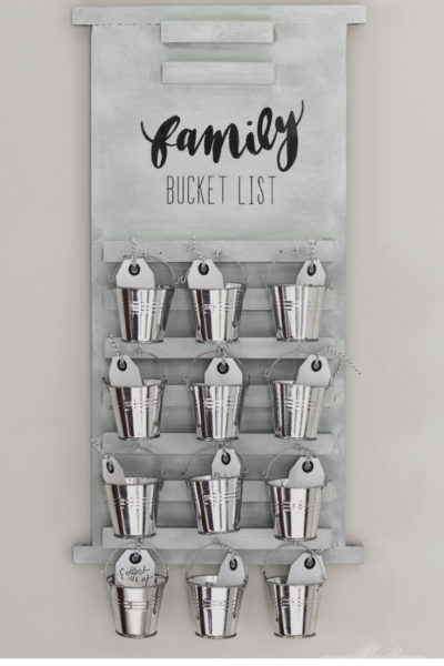 wooden board family bucket list with galvanized buckets