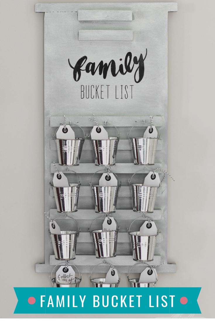 wooden board family bucket list with galvanized buckets