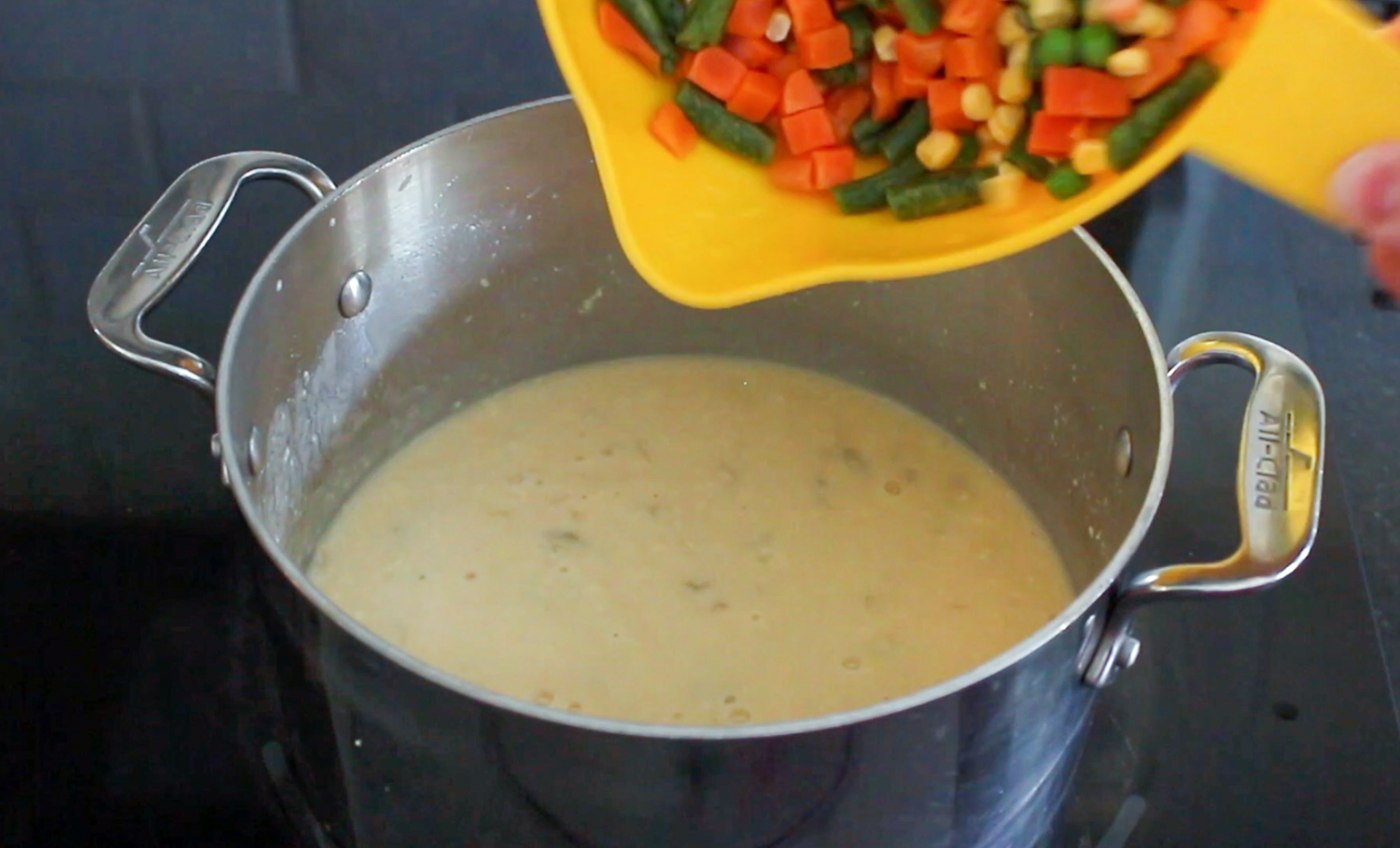 adding vegetables to cream of celery soup
