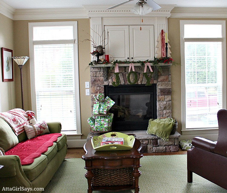 keeping room decorated for Christmas in red and green