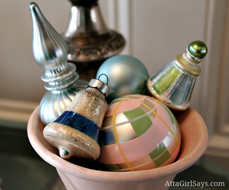vintage pink and green Christmas ornaments in McCoy vase