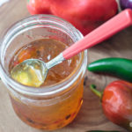 spoon in a jar of homemade pepper jelly
