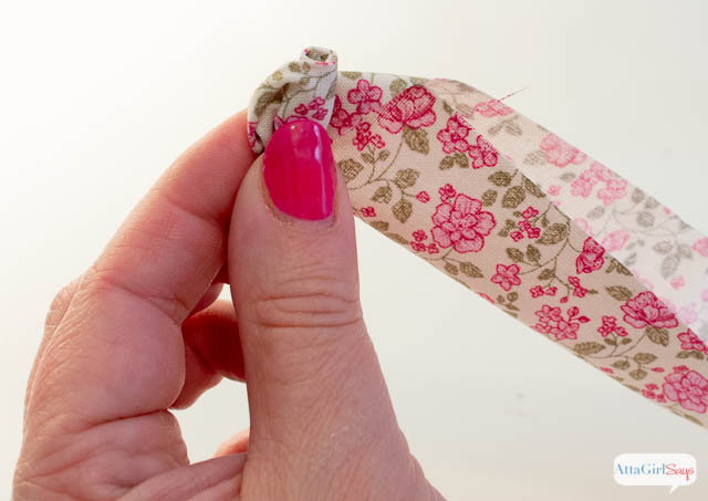 How to Make a Rolled Fabric Flower - Click for a full tutorial at AttaGirlSays.com