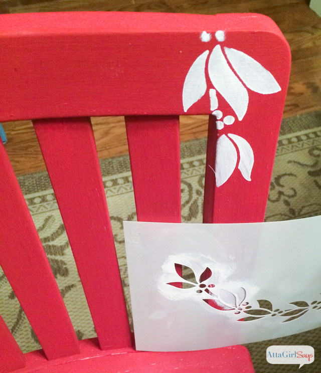 Use Christmas stencils to paint a child's chair for photos