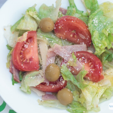 1905 salad with olive, ham, tomatoes and swiss cheese
