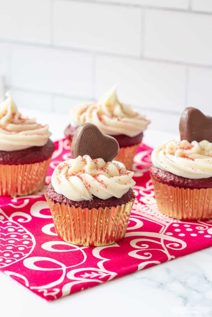 cupcakes with cream cheese icing and chocolate hearts for Valentine's Day