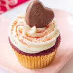 red velvet cupcake with a chocolate heart in the icing
