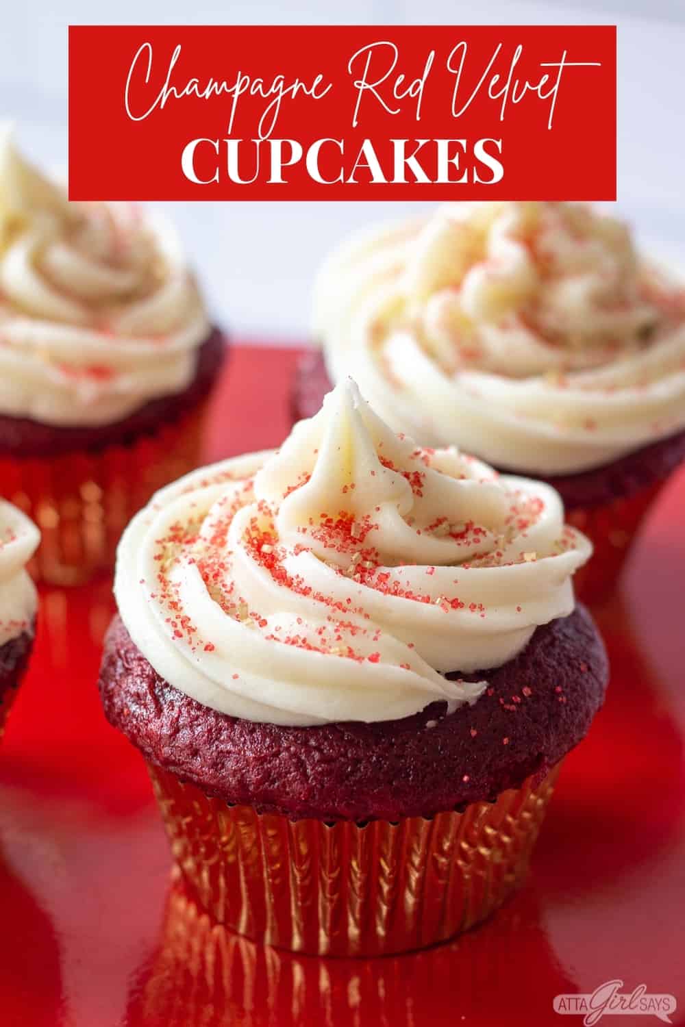 red velvet cupcake with gold and red sugar topping and cream cheese frosting