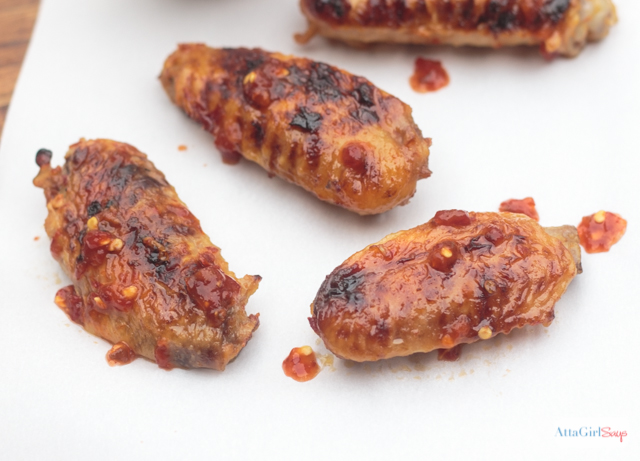 asian grilled chicken wings on parchment paper