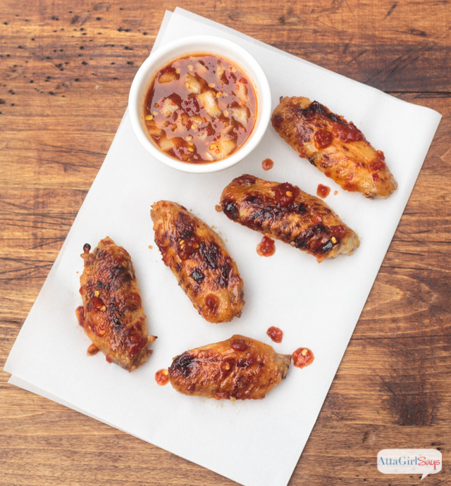 sweet and spicy chicken wings on parchment paper