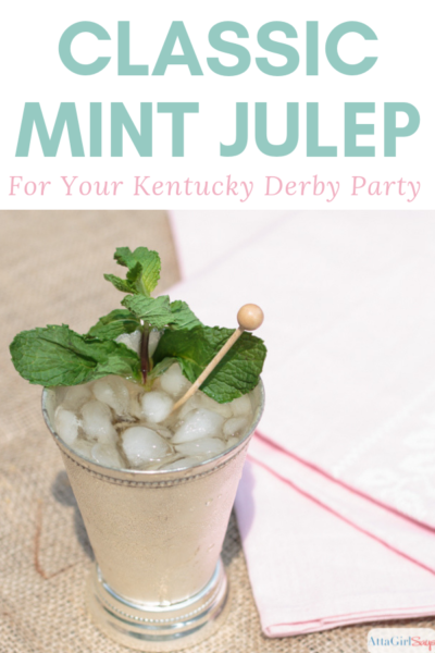 classic mint julep in a silver cup with a swizzle stick