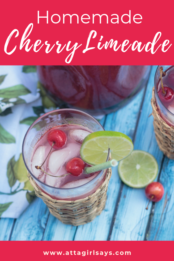 glass of homemade cherry limeade on a blue table