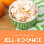 bowl of JELL-O orange salad on a green and white napkin