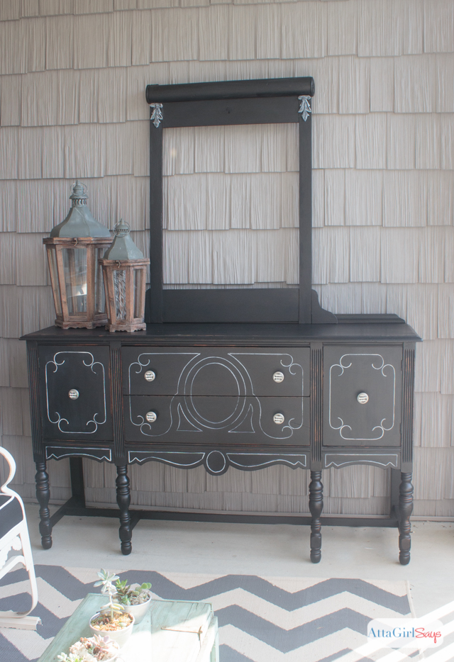 I always worry about painting furniture black because I'm afraid details will get lost. But this vintage buffet is gorgeous. I love the subtle distressing and the white highlights. It really gives new life to a battered, old piece of furniture. #sponsored #decoartprojects #chalkyfinish