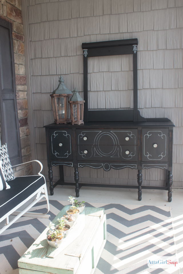 I always worry about painting furniture black because I'm afraid details will get lost. But this vintage buffet is gorgeous. I love the subtle distressing and the white highlights. It really gives new life to a battered, old piece of furniture. #sponsored #decoartprojects #chalkyfinish