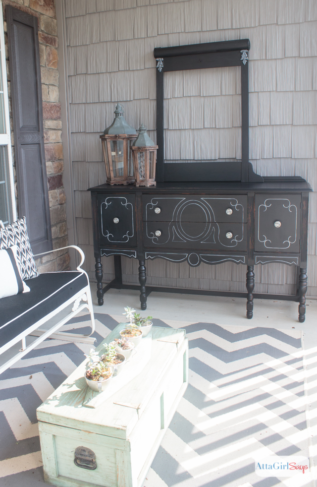 I always worry about painting furniture black because I'm afraid details will get lost. But this vintage buffet is gorgeous. I love the subtle distressing and the white highlights. It really gives new life to a battered, old piece of furniture. #sponsored #decoartprojects #chalkyfinish
