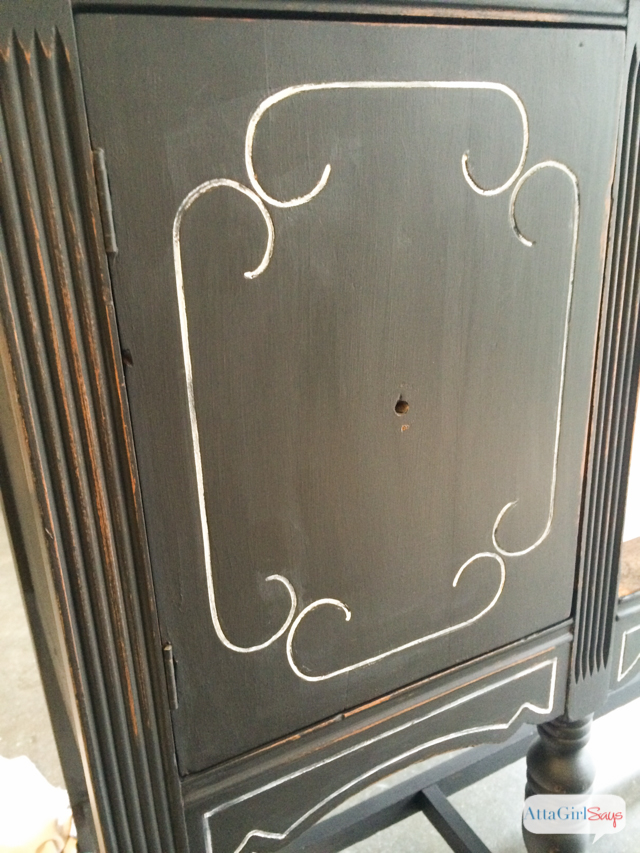 I always worry about painting furniture black because I'm afraid details will get lost. But this vintage buffet is gorgeous. I love the subtle distressing and the white highlights. It really gives new life to a battered, old piece of furniture. #sponsored #decoartprojects #chalkyfinish