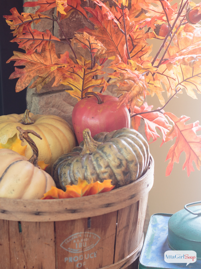 How to decorate a mantel using traditional fall colors and natural elements.