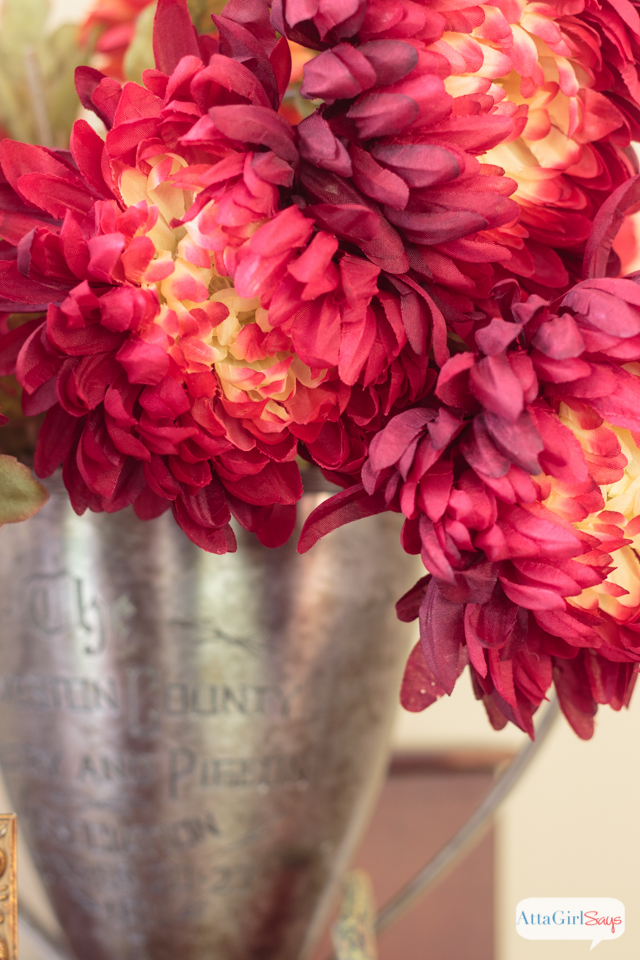 How to decorate a mantel using traditional fall colors and natural elements.
