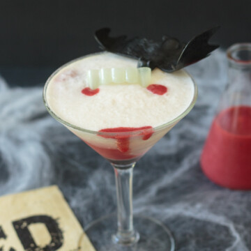 Halloween cocktail with strawberry puree