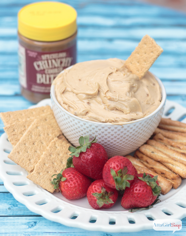 bowl of cookie butter dip with strawberries and graham crackers