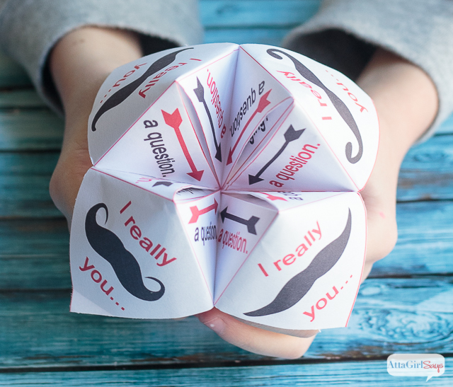 child holding a cootie catcher