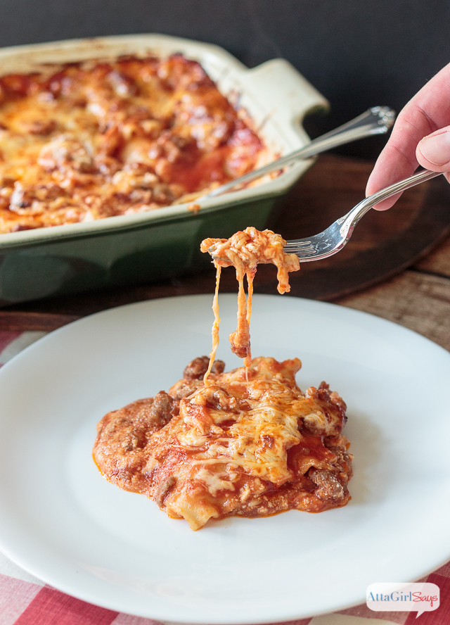 cheesy homemade lasagna on a white plate