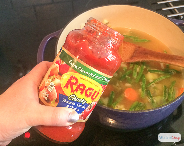 adding tomato sauce to minestrone soup