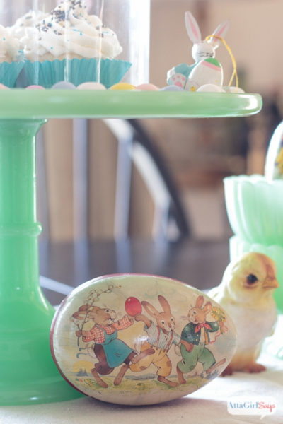 jadeite cake stand and paper easter egg on a dining room table