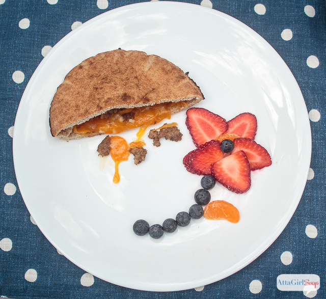 Looking for quick and easy breakfast ideas for kids? Try these stuffed pita breakfast sandwiches, filled with sausage, cheese and other toppings. Goes great with a glass of Nesquik. #ad #stirimagination
