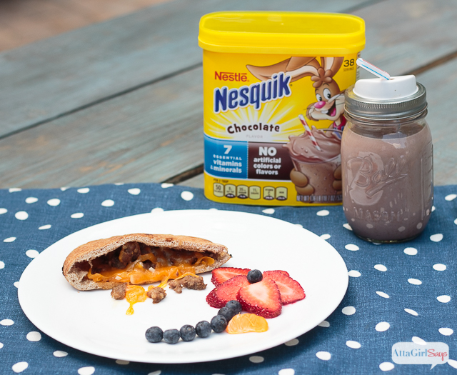 Looking for quick and easy breakfast ideas for kids? Try these stuffed pita breakfast sandwiches, filled with sausage, cheese and other toppings. Goes great with a glass of Nesquik. #ad #stirimagination