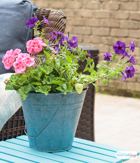 Give wooden outdoor patio furniture a makeover with paint! I love how the turquoise paint transformed this folding side table.