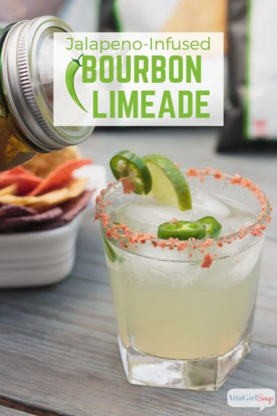 pouring jalapeno bourbon limeade into a glass