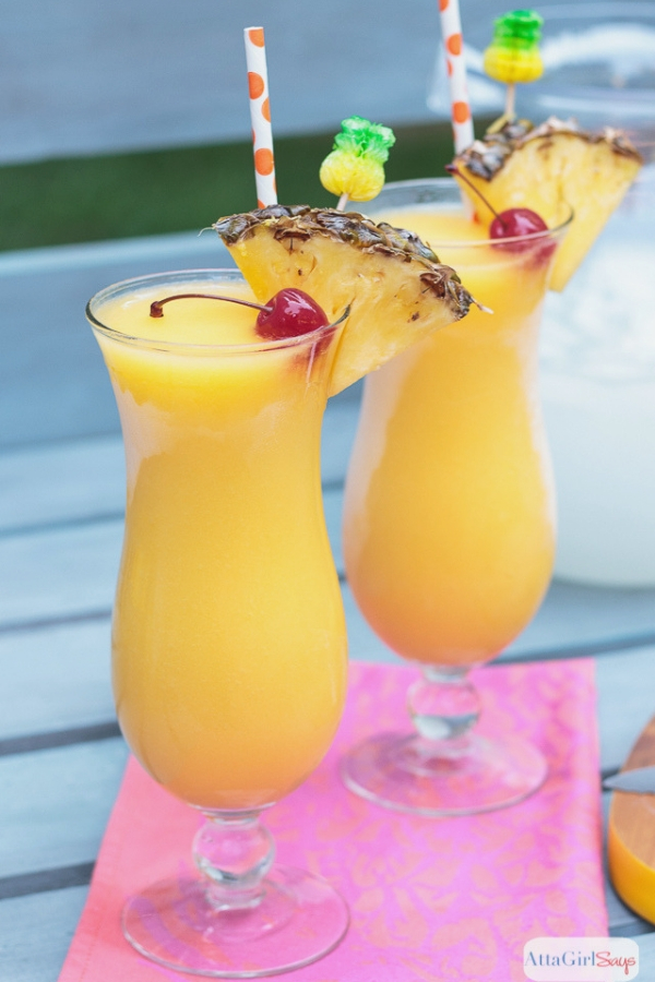 spiked frozen lemonade with pineapple infused rum in hurricane glasses