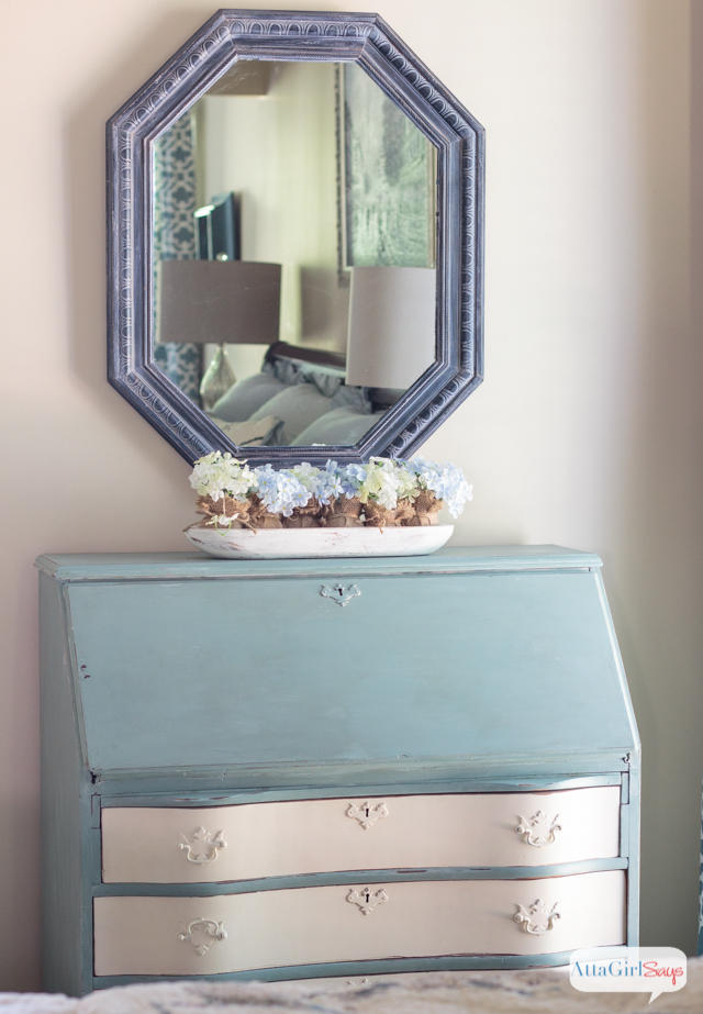 blue whitewashed mirror over a blue and white secretary desk