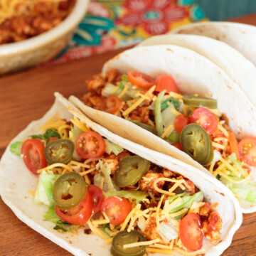 soft tacos with ground chicken, jalapenos and toppings