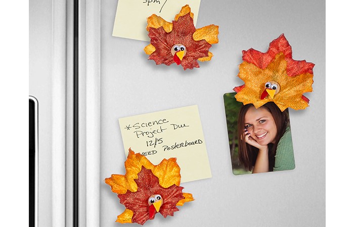 turkey leaft magnets holding notes and photos on a refrigerator