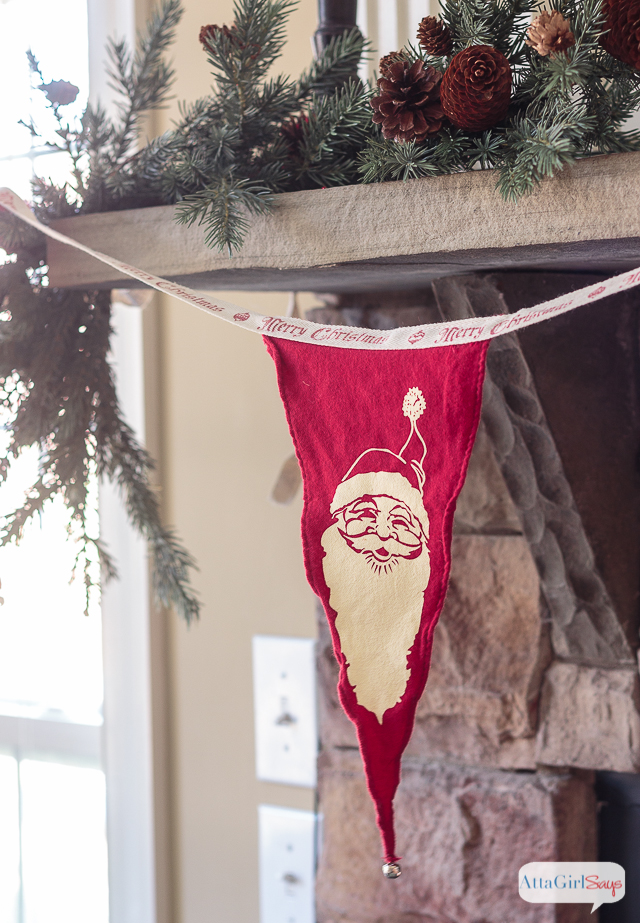 I love all the vintage and rustic Christmas decor she used to decorate this gorgeous stone fireplace mantel for the holidays.