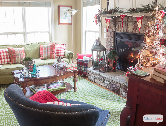I love all the vintage and rustic Christmas decor she used to decorate this gorgeous stone fireplace mantel for the holidays.