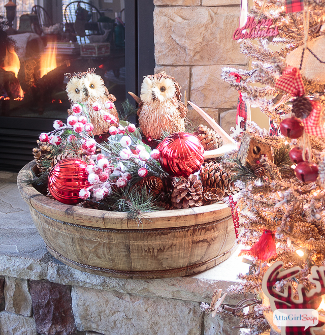 I love all the vintage and rustic Christmas decor she used to decorate this gorgeous stone fireplace mantel for the holidays.