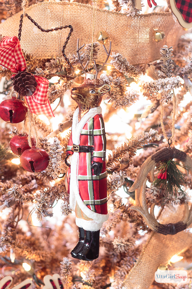 I love all the vintage and rustic Christmas decor she used to decorate this gorgeous stone fireplace mantel for the holidays.