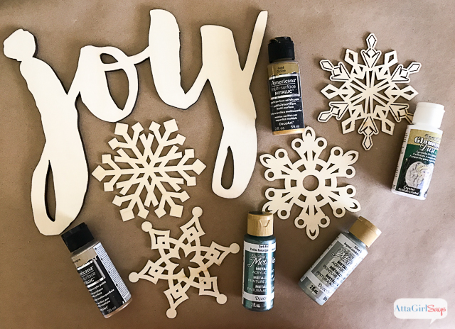 You don't need expensive paper or fancy ribbon to wrap beautiful gifts. Check out these inexpensive Christmas gift wrapping ideas, including tips for dressing up plain wrapping paper, a tutorial to make make glittery package toppers and a technique for making gift bags out of any kind of paper you have on hand. #ad #decoartprojects 