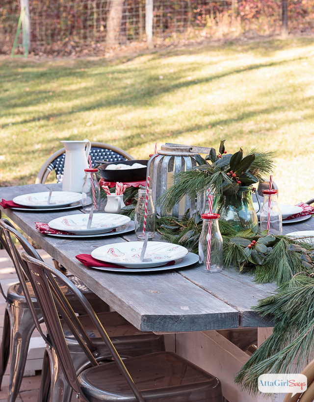 If you live in a temperate climate, invite friends and family over for a Christmas brunch outside. I used simple greenery, galvanized accessories and milk bottles to give our farmhouse table a festive touch.
