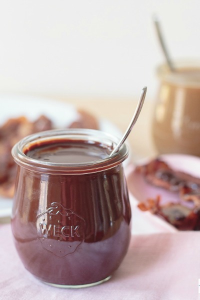 Part appetizer, part dessert and totally delicious, this caramel chocolate bacon is a decadent Valentine's Day treat. The homemade chocolate and caramel sauces are delicious on their own. But wait until you try some thick applewood smoked bacon dipped in these sauces. Flavor explosion. Mind blown! #bacon #chocolate #caramel #chocolatebacon