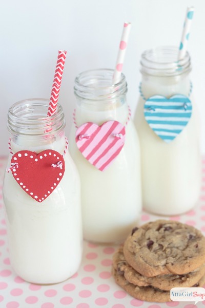 wooden heart charms on glass milk bottles