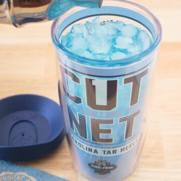 blue cocktail in a Carolina insulated Tervis cup
