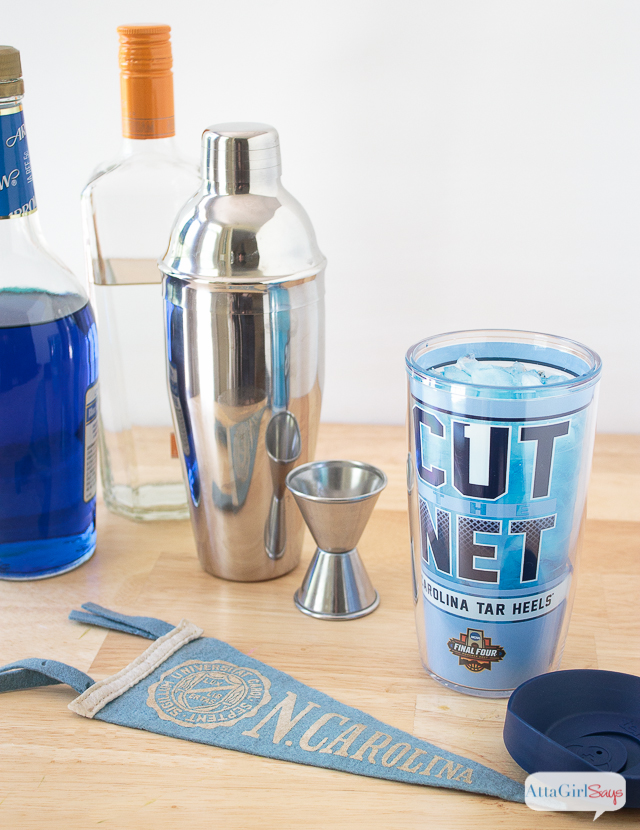 cocktail shaker, jigger, blue curacao and vokda with a Tervis tumbler