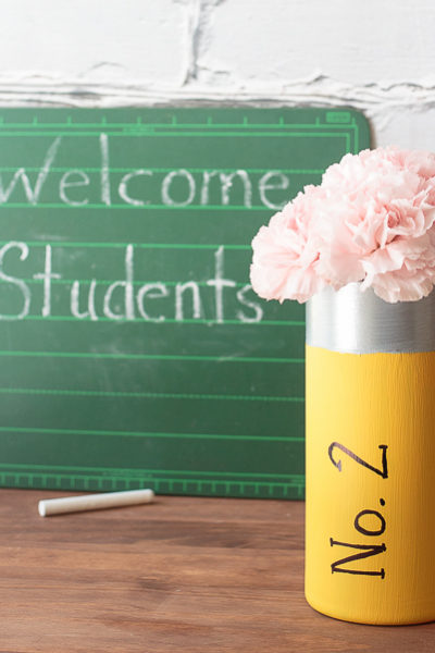 Looking for inexpensive teacher appreciation gifts. Paint a glass vase to look like a No. 2 pencil, then add a cluster of carnations as the "eraser."