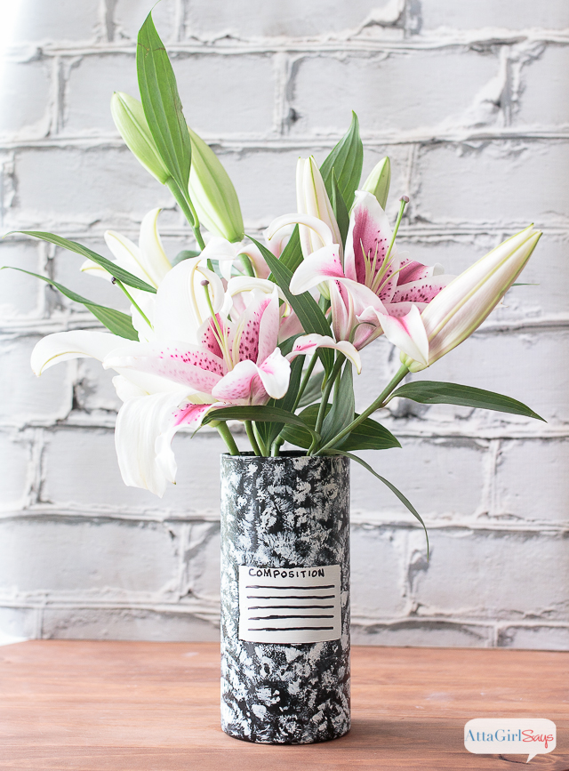 Use paint to transform a clear glass vase into teacher appreciation gifts. This one is painted to look like an old-school composition notebook and filled with a bouquet of beautiful pink and white lilies.